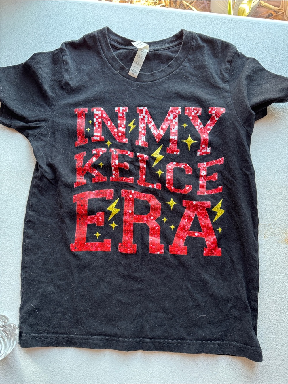 Bella Canvas Black Short-Sleeve Tee with Red Glitter Letters and Yellow Accents